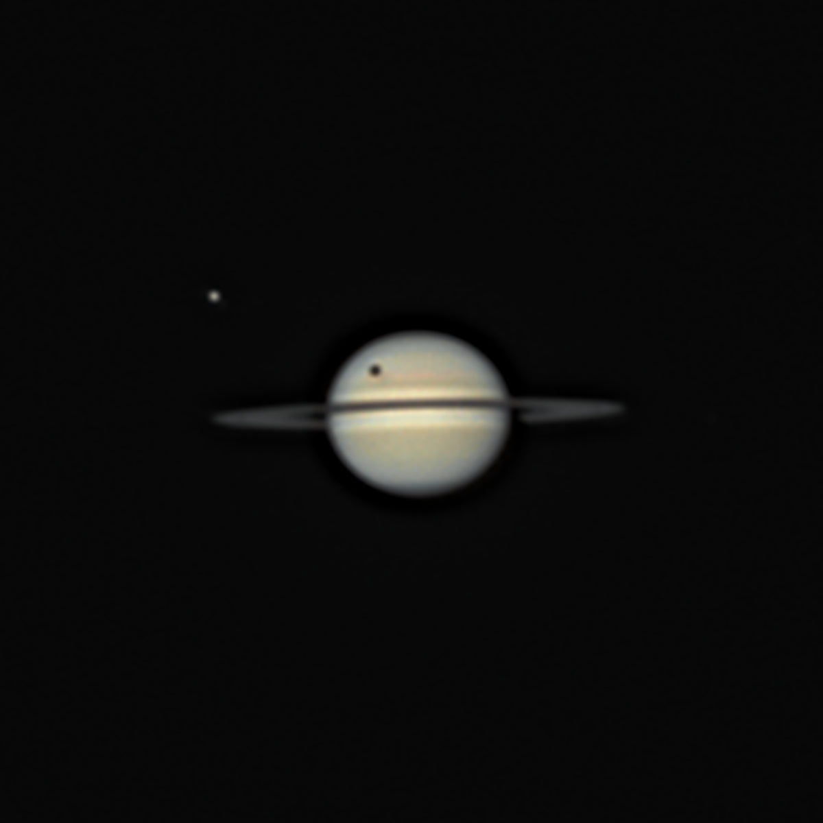 Astrophotographer captures rare sight: Titan's shadow transiting Saturn